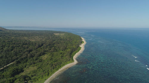 Aerial view of seashore with beach, lagoons and coral reefs. philippines, luzon. 