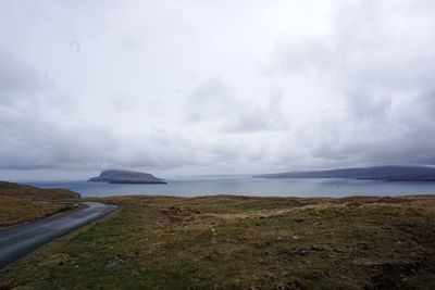 Scenic view of sea against cloudy sky