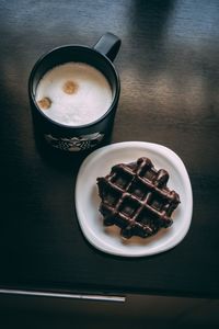 High angle view of coffee served on table