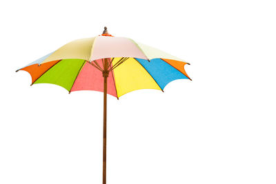 Colorful umbrella against white background
