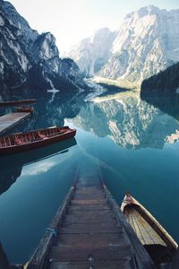 Scenic view of lake by snowcapped mountains