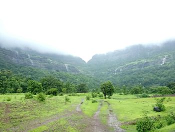 Countryside landscape with mountain range in background