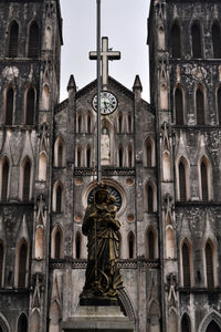 Low angle view of statue against building