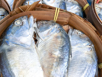 Top view closeup mackerel fishes in bamboo baskets at the food store in fresh market