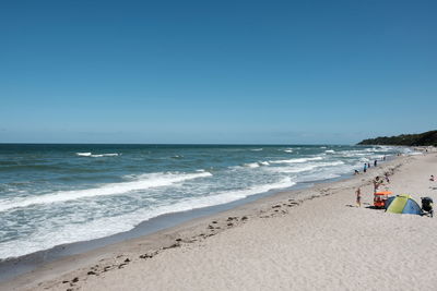 Scenic view of beach against clear sky