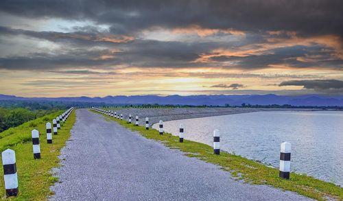 Scenic view of road against sky during sunset