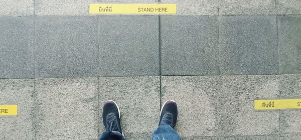 Low section of person standing on floor