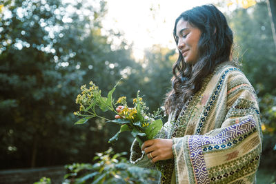 Woman holding wildflowers