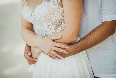 Midsection of pregnant woman standing outdoors