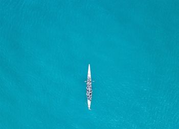 Directly above view of people sculling in river