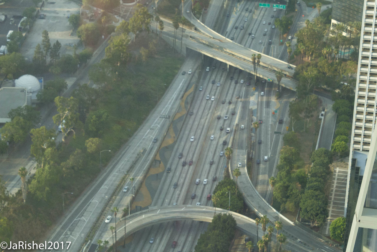 HIGH ANGLE VIEW OF TRAFFIC ON ROAD