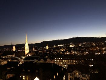 High angle view of buildings in city at night