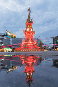 Reflection of illuminated building in water