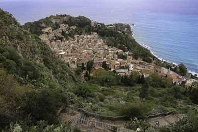 High angle view of townscape by sea