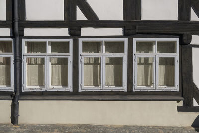 Reflection of building on glass window