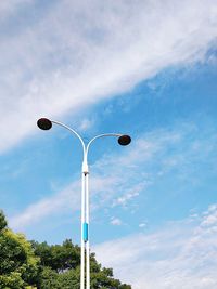 Low angle view of street light against sky