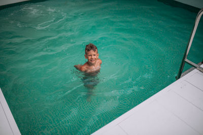 High angle view of man swimming in pool