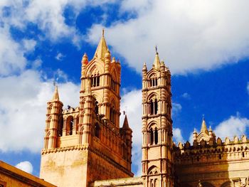 Low angle view of cathedral against cloudy sky