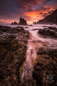 Scenic view of sea against sky during sunset