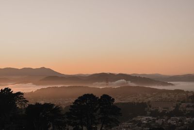 Scenic view of mountains against sky during sunset