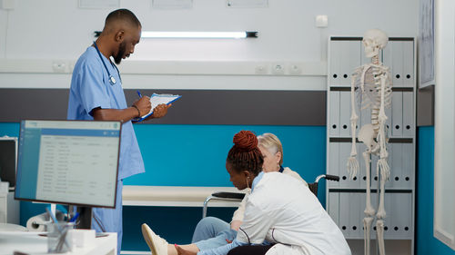 Female doctor working in office