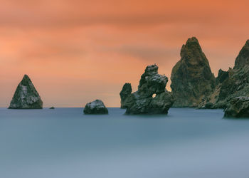 Scenic view of sea against sky at sunset