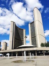 Low angle view of modern buildings against sky