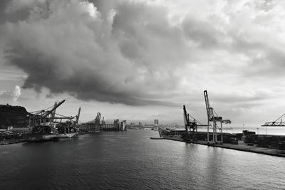 Pier at harbor against sky