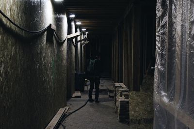 Man in illuminated room