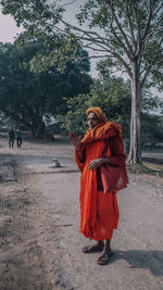 Rear view of man walking in park