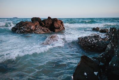 Waves splashing on rocks