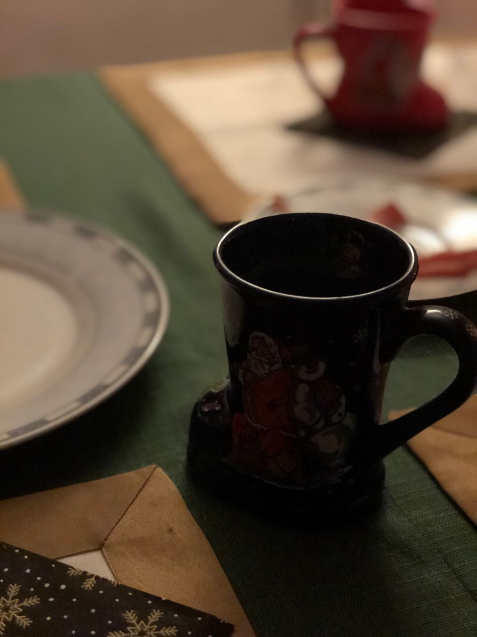 CLOSE-UP OF COFFEE CUP ON TABLE AT CAFE