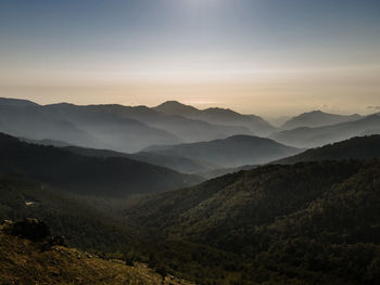 Scenic view of mountains against sky during sunset