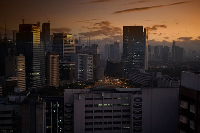 Cityscape against sky at dusk