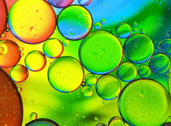 Colorful bubbles abstract background, oil bubbles in transparent liquid backdrop