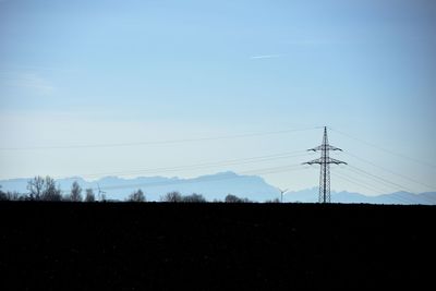 Electricity pylon on field