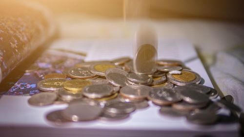 Close-up of coins on table