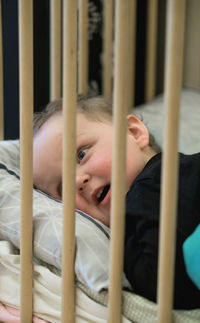 Portrait of baby boy on bed