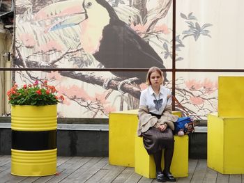 Rear view of woman standing in city