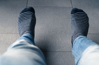 Low section of man wearing shoes