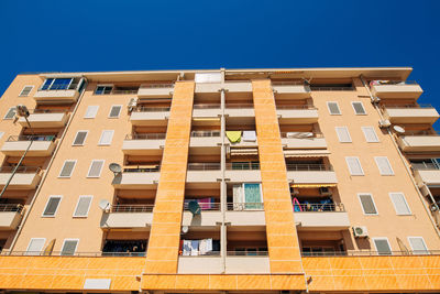 Low angle view of building against blue sky