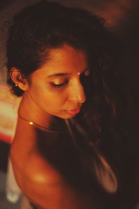 Close-up portrait of a young woman looking away