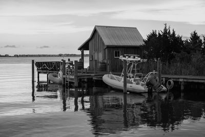 Pier on lake against sky