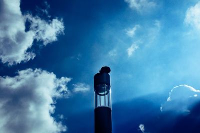 Low angle view of smoke stack against sky