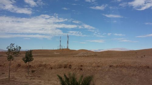 Scenic view of landscape against blue sky