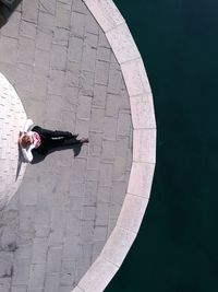 High angle view of woman sitting at observation point