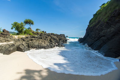 Scenic view of sea against blue sky