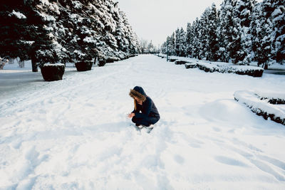 Woman on snow covered field