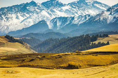 Scenic view of snowcapped mountains against sky