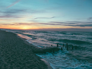 Scenic view of sea against sky at sunset